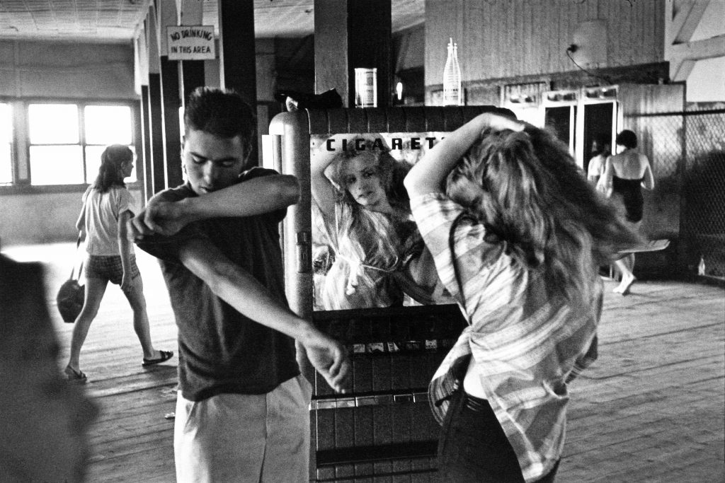 Bruce Davidson Cathy Fixing her Hair in Cigarette Machine Mirror, 1959