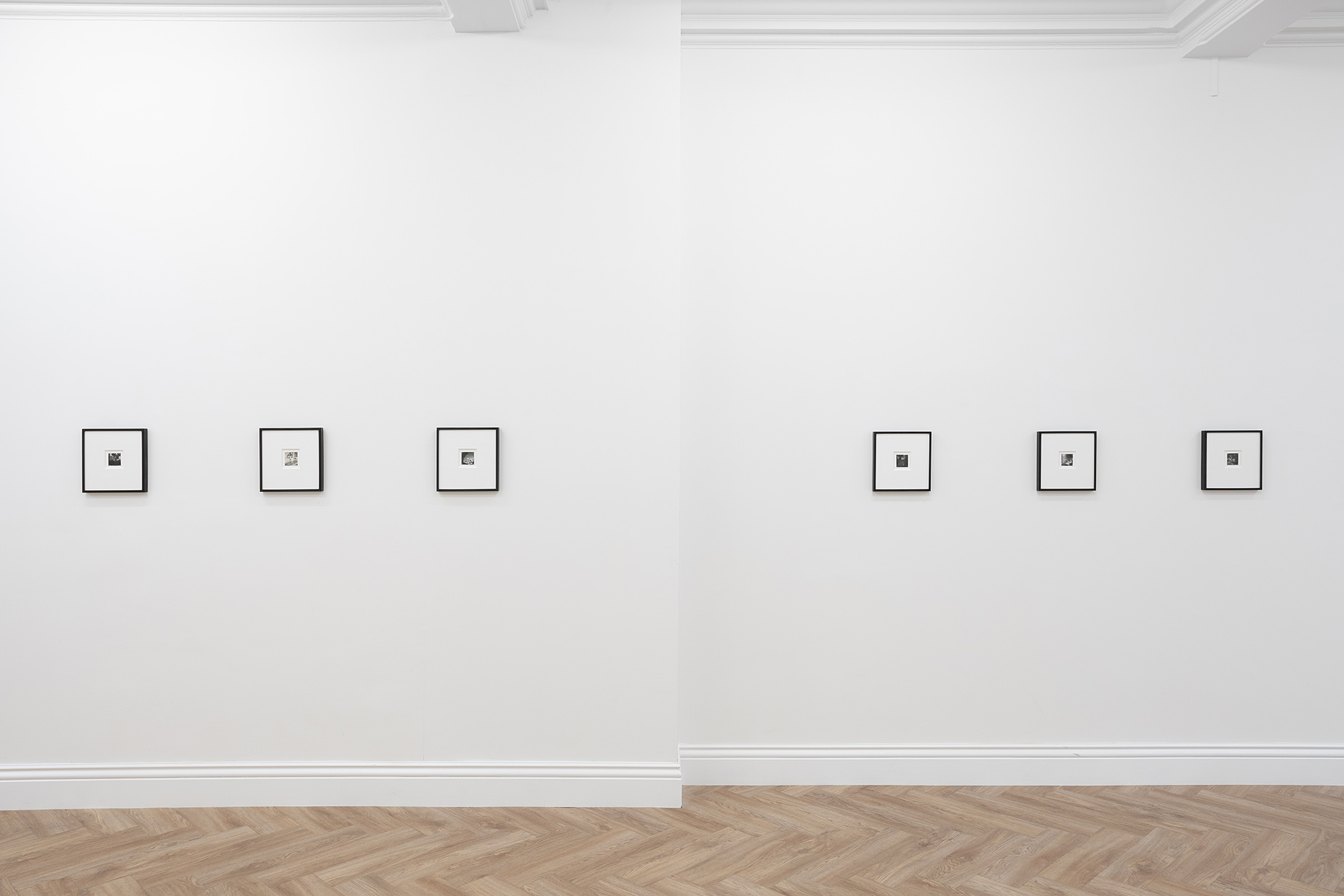 Six early twentieth-century small contact prints hung in black frames on a white wall. At Huxley-Parlour Gallery's exhibition of Dora Maar's photography at 45 Maddox Street, W1S 2PE.
