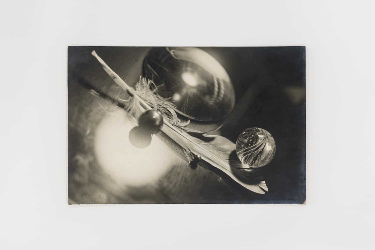 Circle of Emile Langui, Surreal Still Life of Feather, Marbles and Crystal, c. 1928. Modern Objects, Huxley-Parlour Gallery, 3–5 Swallow St, London, W1B 4DE.