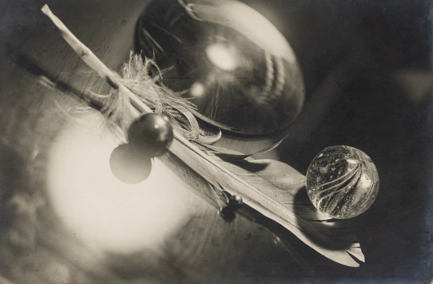 Circle of Emile Langui, Surreal Still Life of Feather, Marbles and Crystal, c. 1928. Modern Objects, Huxley-Parlour Gallery, 3–5 Swallow St, London, W1B 4DE.