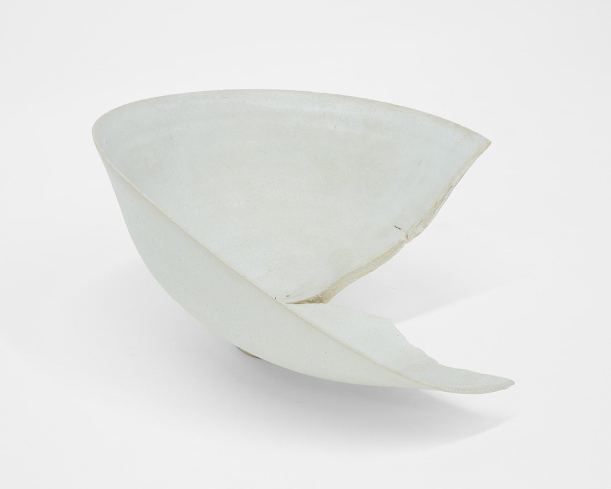 Lucie Rie, White Porcelain Bowl Split in Firing, c. 1978, Huxley-Parlour, 25.04–31.05.25