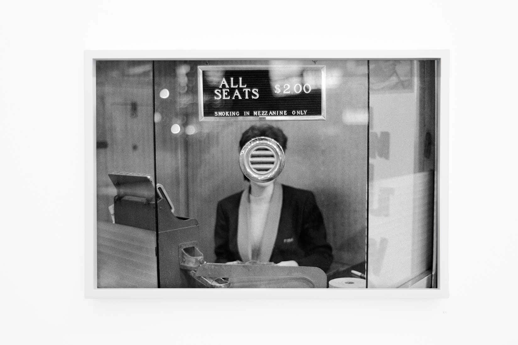 Black and white photo of woman distorted by a reflection.