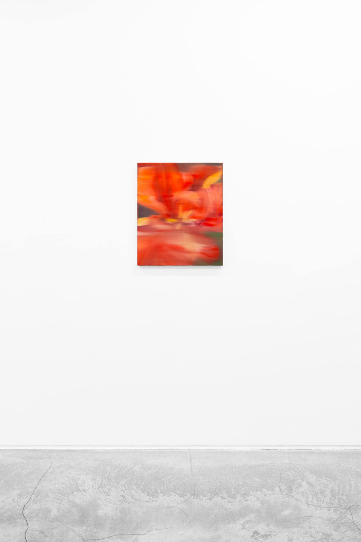 Painting of a flower in warm red and orange tones.