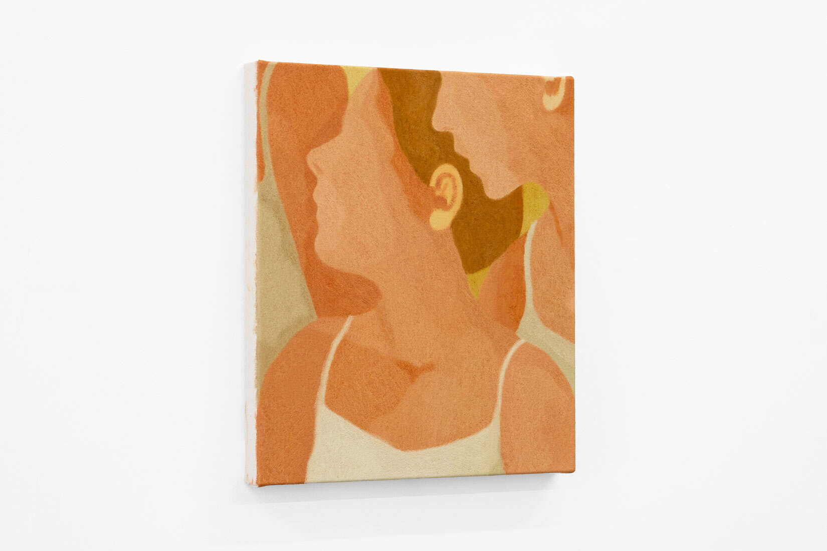 Abstracted painting of two women's side profiles in warm tones.