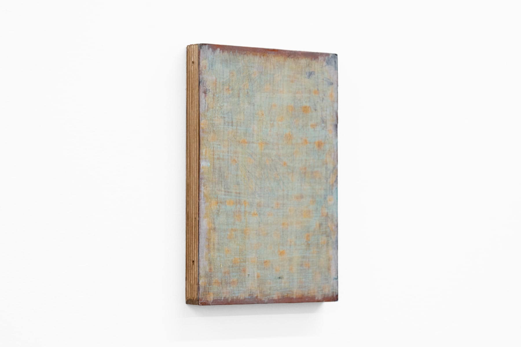 Abstract painting of blue and orange on paper and wood.