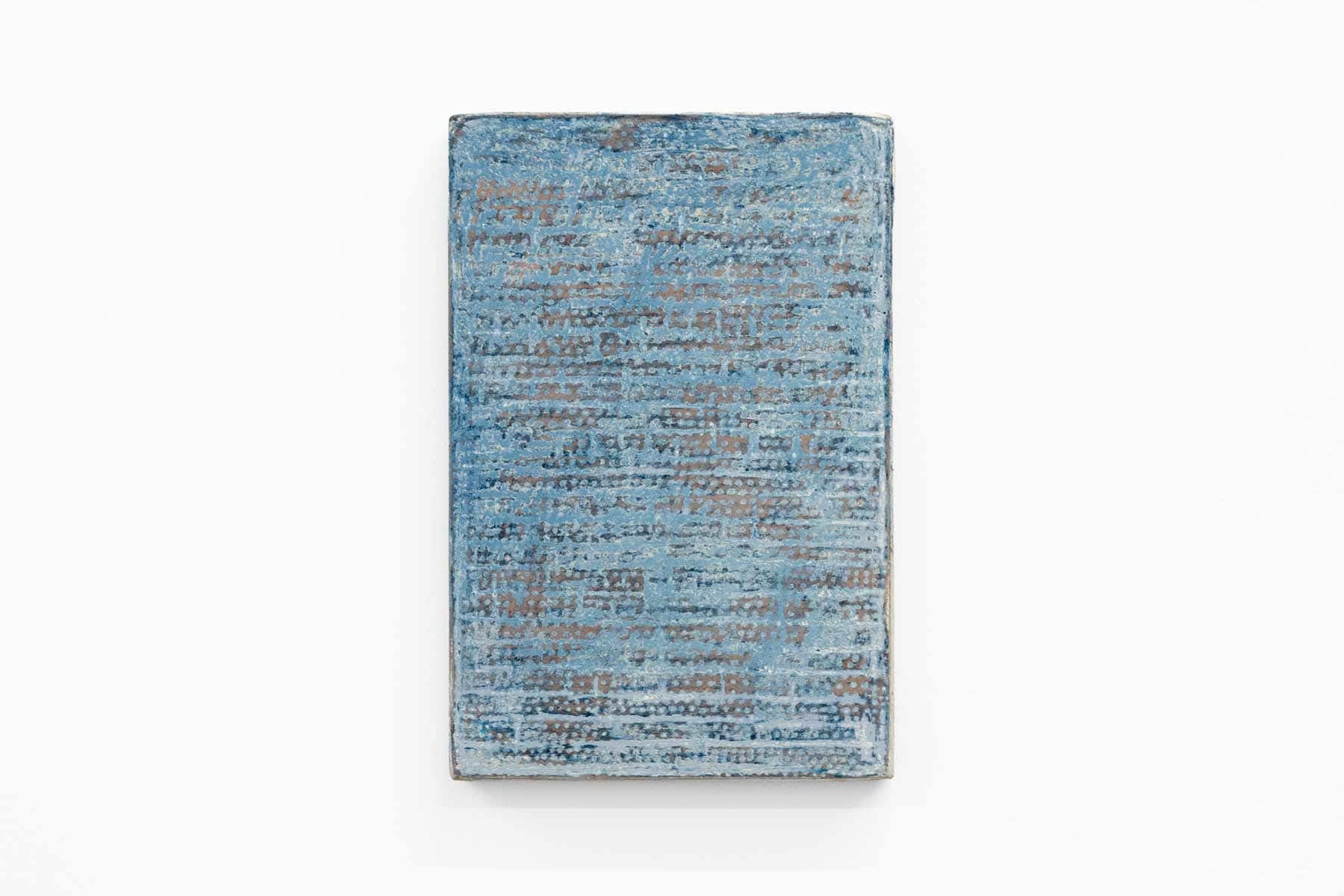 Abstract painting of speckled blue on paper and wood.