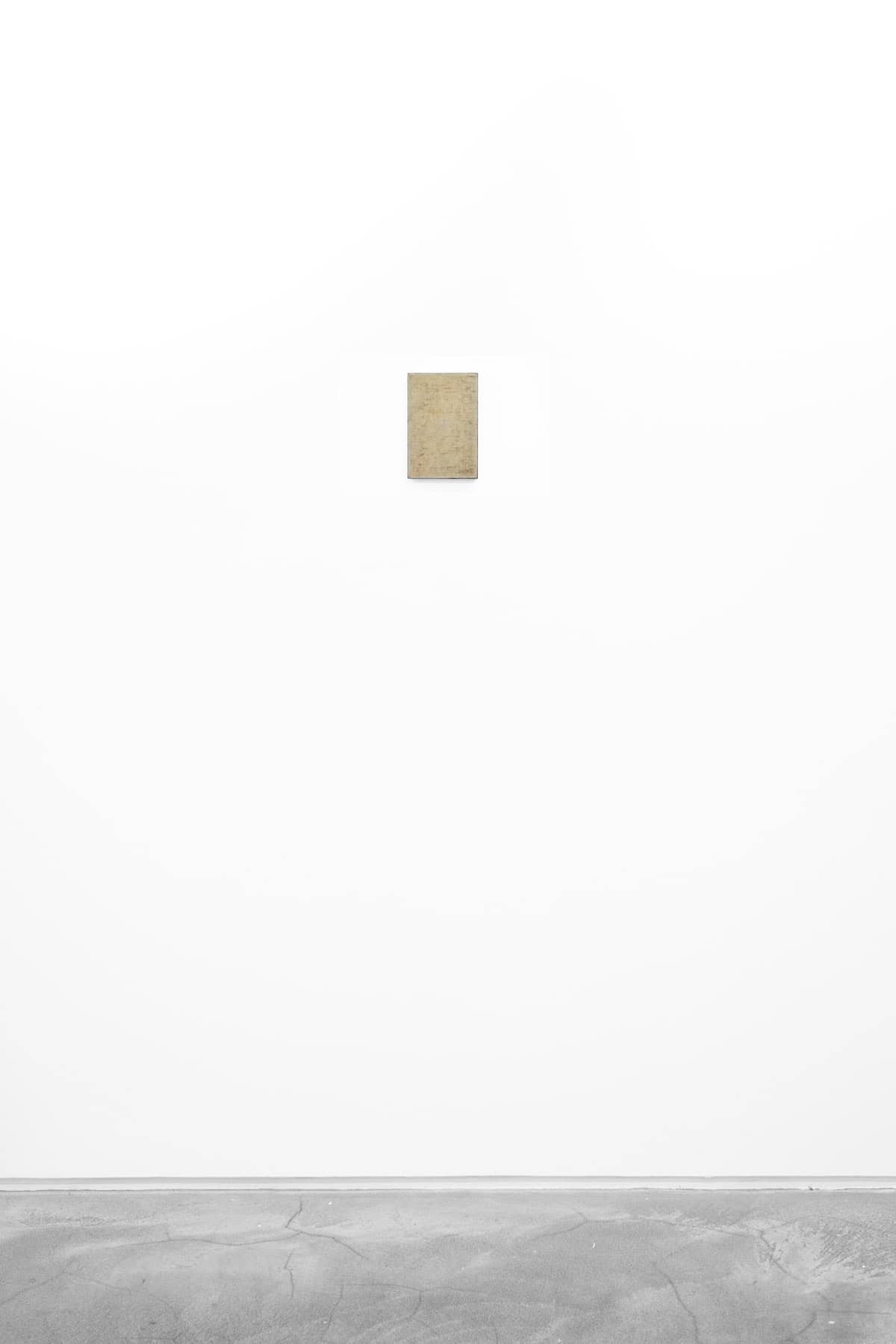 Abstract painting of neutral colours on paper and wood.