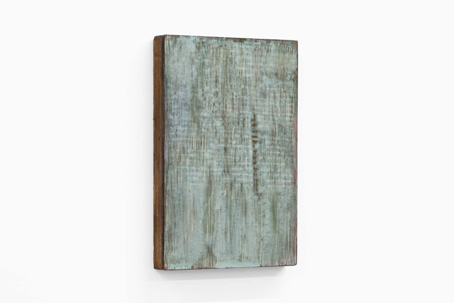 Abstract painting of green and blue on paper and wood.