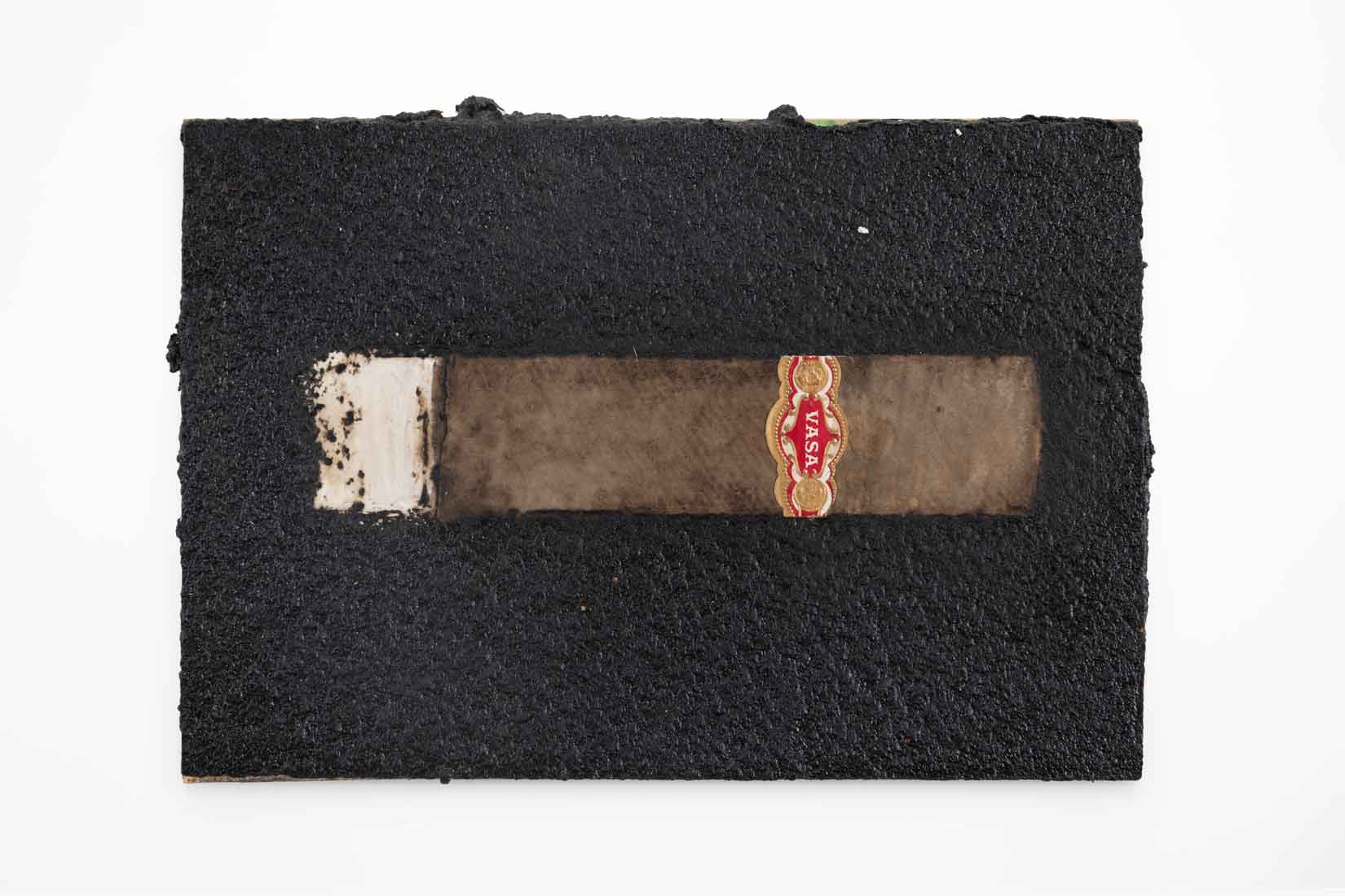 An artwork with a black background and a brown cigar in the center.