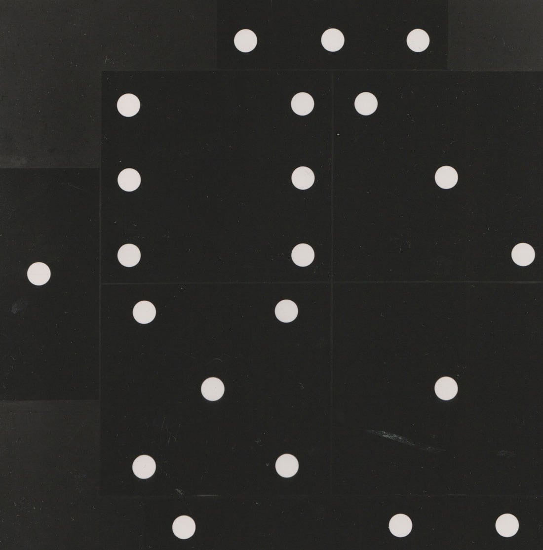 An artwork with a black background and white dots.