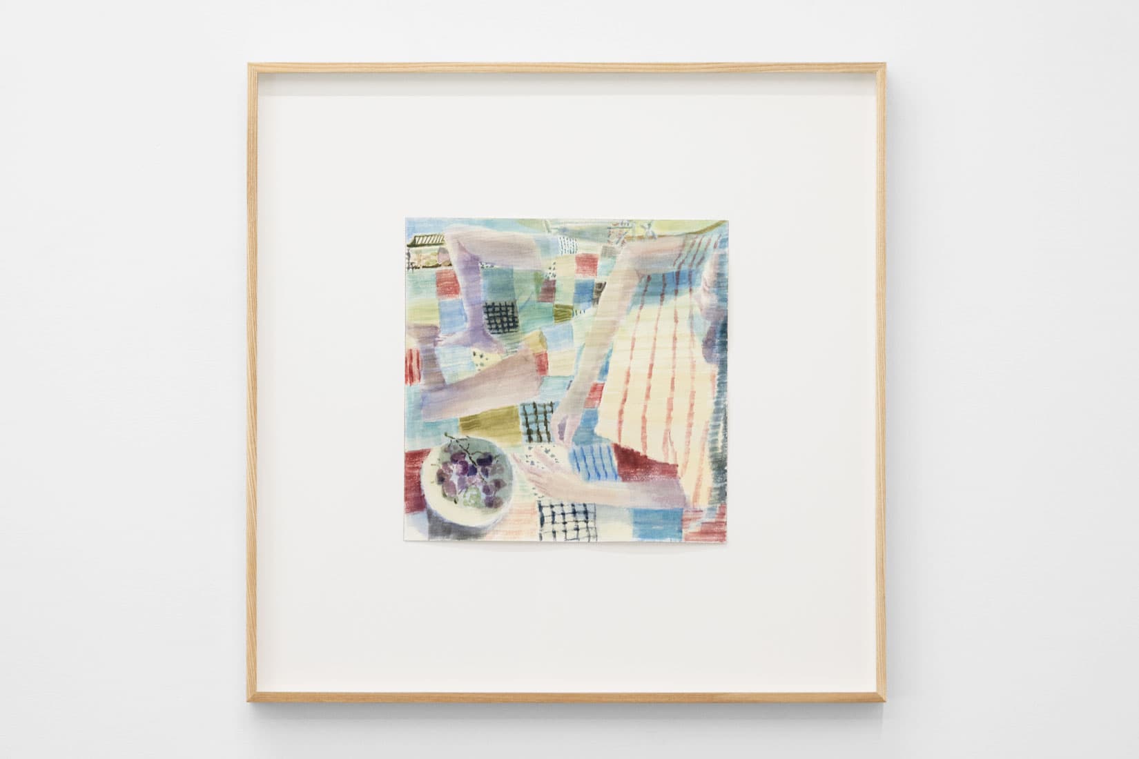 Watercolour painting of a person eating fruit on a quilted blanket.