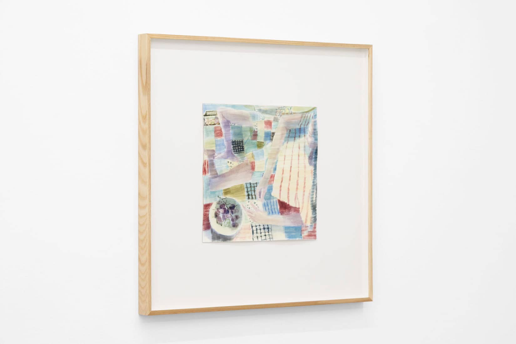 Watercolour painting of a person eating fruit on a quilted blanket.